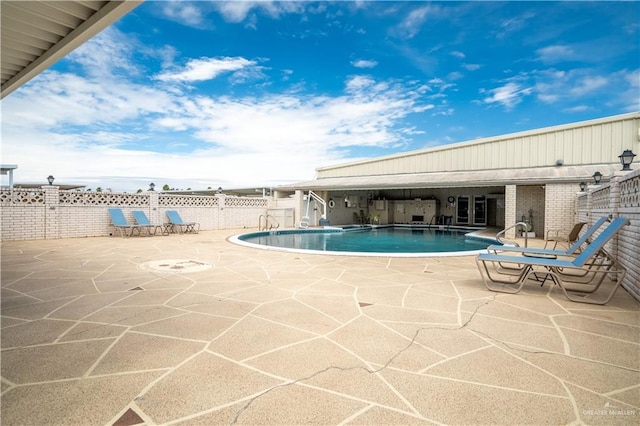 view of pool featuring a patio