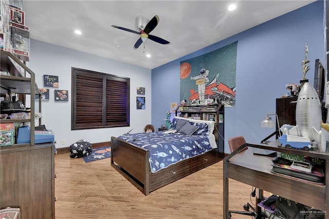 bedroom with ceiling fan and wood-type flooring