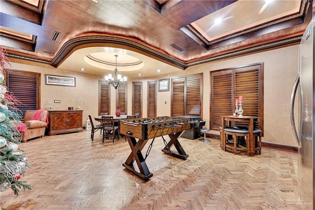 recreation room featuring light parquet floors and a chandelier