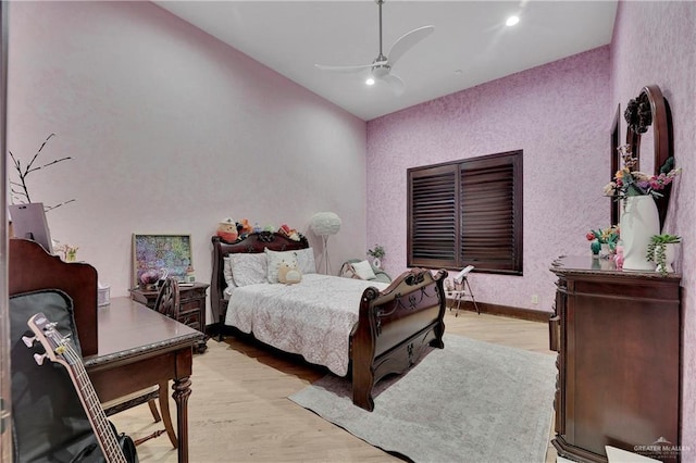 bedroom featuring light hardwood / wood-style flooring and ceiling fan