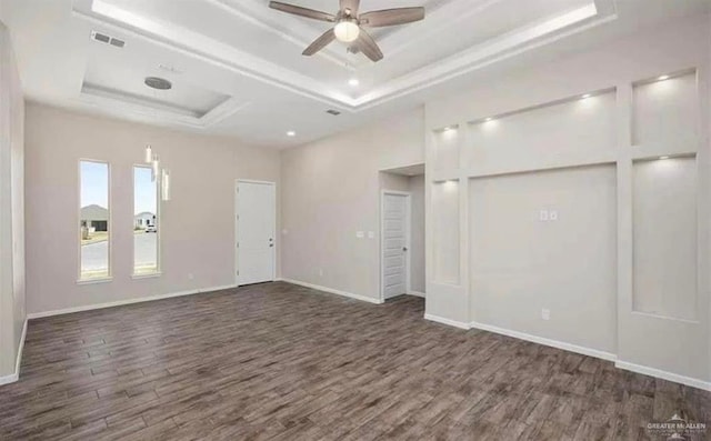 1301 Frente Al Mar Dr, Weslaco, TX 78596 - spare room with a raised ceiling, dark wood-style floors, ceiling fan, baseboards, and recessed lighting