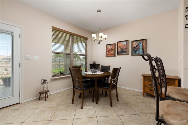 dining area featuring a chandelier, light tile patterned floors, and a wealth of natural light