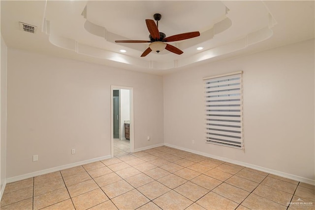 1711 Esperanza Ave, Hidalgo, TX 78557 - unfurnished room featuring a raised ceiling, recessed lighting, a ceiling fan, and light tile patterned floors
