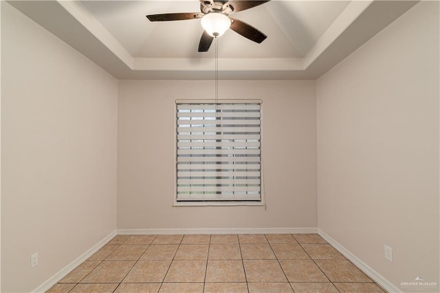 1711 Esperanza Ave, Hidalgo, TX 78557 - spare room featuring a raised ceiling, a ceiling fan, and light tile patterned floors