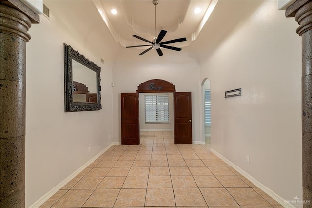1711 Esperanza Ave, Hidalgo, TX 78557 - hallway with light tile patterned flooring, arched walkways, a raised ceiling, and a towering ceiling