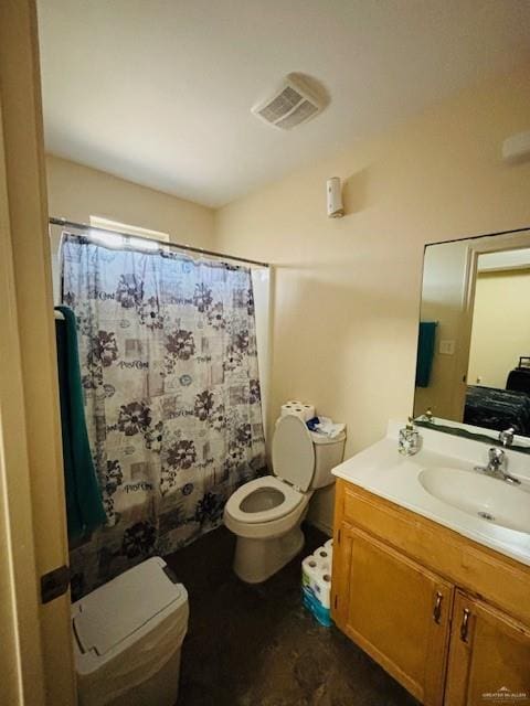 bathroom featuring curtained shower, vanity, and toilet