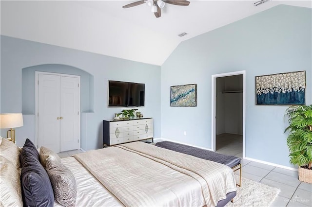 3004 San Federico Rd, Mission, TX 78572 - bedroom with vaulted ceiling, visible vents, light tile patterned flooring, a closet, and baseboards