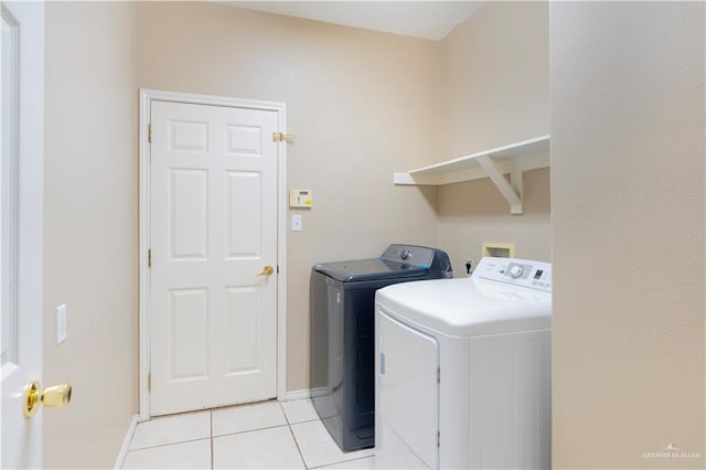 3004 San Federico Rd, Mission, TX 78572 - clothes washing area featuring baseboards, light tile patterned flooring, laundry area, and independent washer and dryer