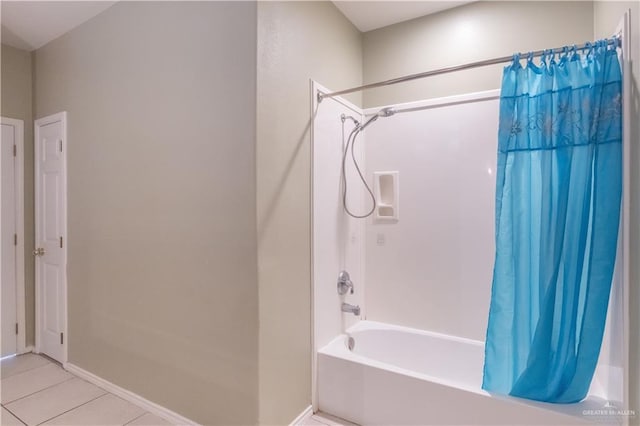 3004 San Federico Rd, Mission, TX 78572 - bathroom featuring tile patterned floors, baseboards, and shower / tub combo with curtain