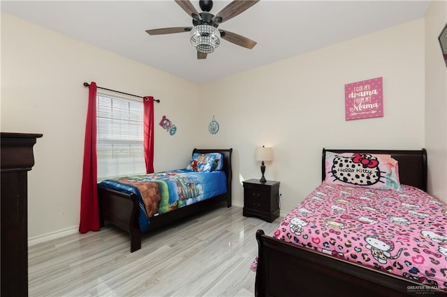 bedroom featuring ceiling fan and light hardwood / wood-style floors