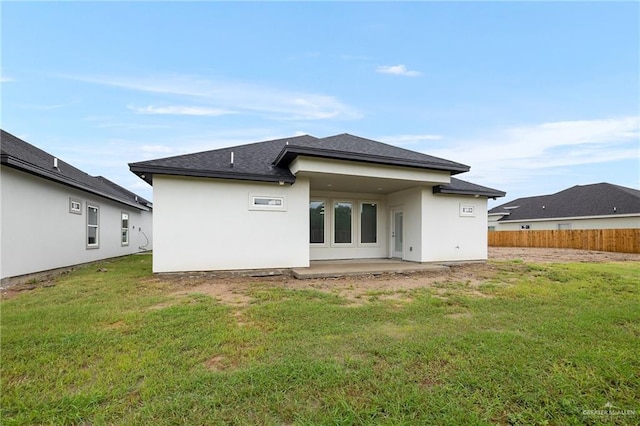 1232 Bridle Way, San Benito, TX 78586 - rear view of house featuring a patio area, stucco siding, and roof with shingles