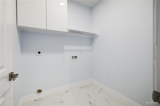 1232 Bridle Way, San Benito, TX 78586 - laundry room featuring washer hookup, cabinet space, light marble finish flooring, and baseboards