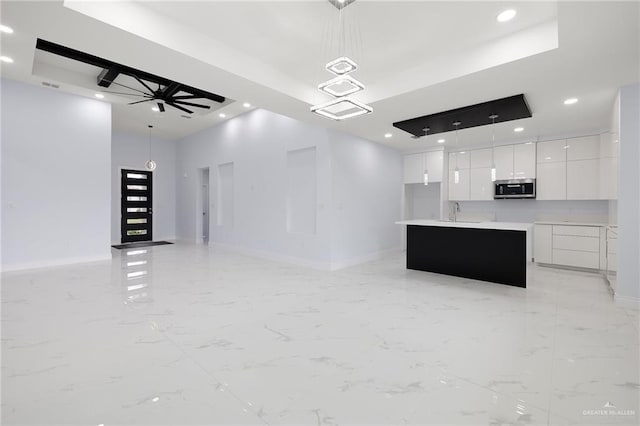 1232 Bridle Way, San Benito, TX 78586 - unfurnished living room featuring recessed lighting, baseboards, light marble finish flooring, a sink, and a ceiling fan