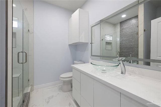 1232 Bridle Way, San Benito, TX 78586 - bathroom featuring toilet, a shower stall, vanity, baseboards, and marble finish flooring