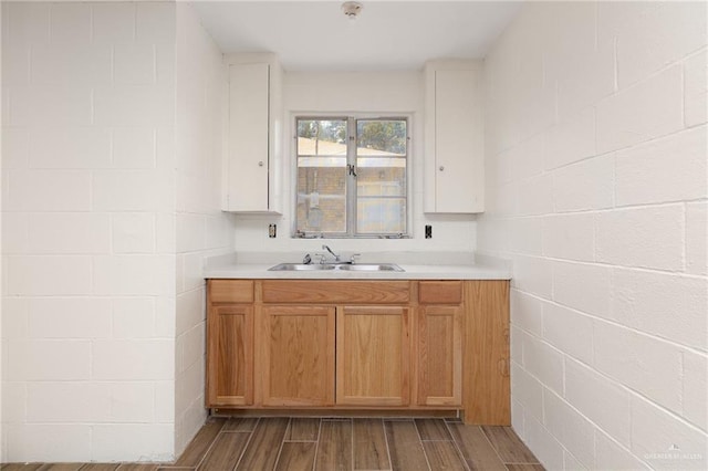 816 E 12th St, Mission, TX 78572 - kitchen with light countertops, wood finished floors, and concrete block wall