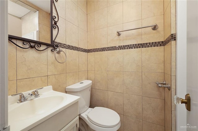 816 E 12th St, Mission, TX 78572 - bathroom featuring tile walls and vanity