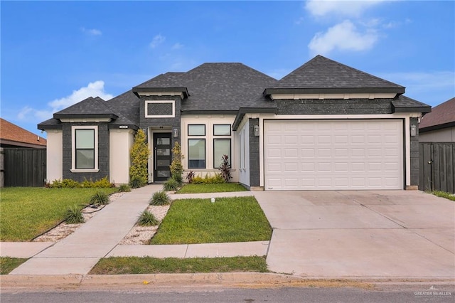 4610 Vikings Dr, San Juan, TX 78589 - view of front of house featuring driveway, a garage, fence, a front lawn, and a shingled roof