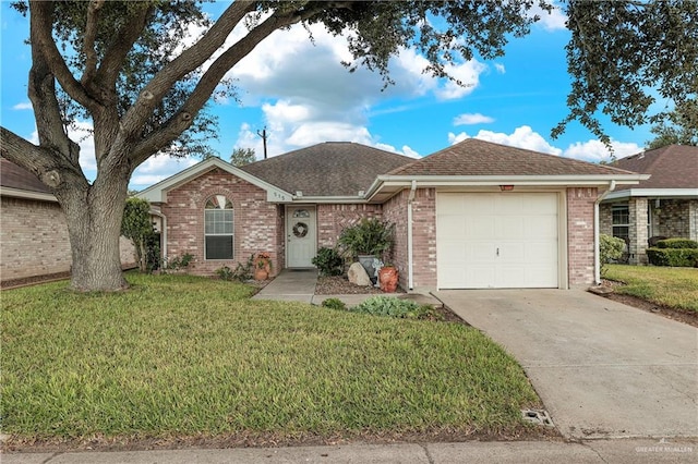 single story home featuring a front yard and a garage