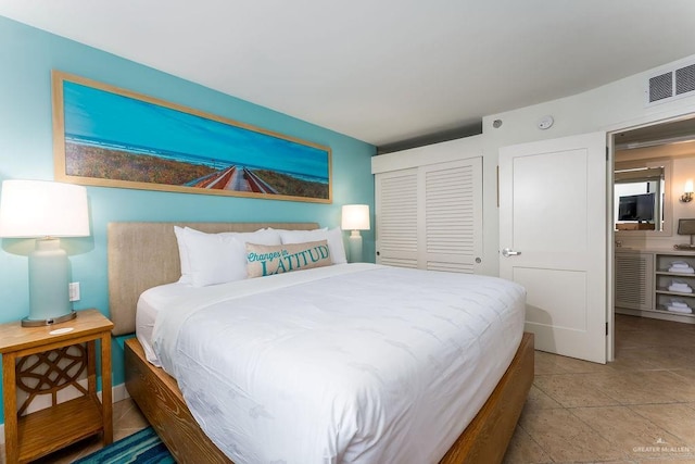 bedroom with visible vents and a closet