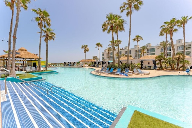 community pool featuring a patio and a gazebo