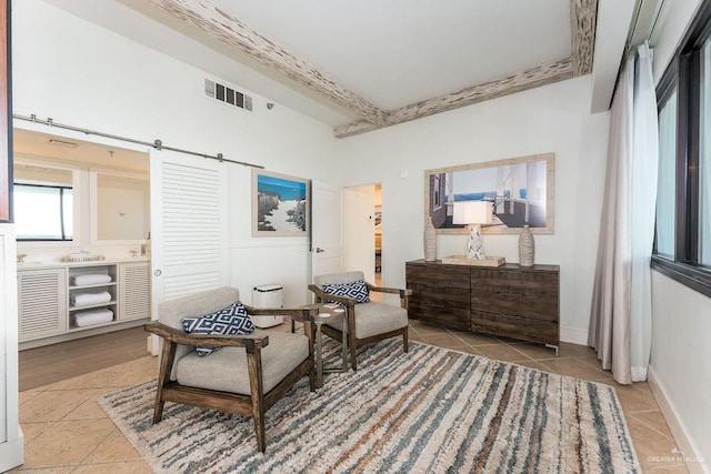 sitting room with light tile patterned flooring and visible vents