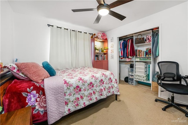 carpeted bedroom featuring ceiling fan and a closet