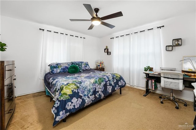 bedroom with ceiling fan and carpet