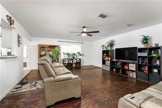 living room with ceiling fan and dark hardwood / wood-style flooring