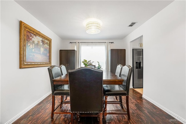 dining area with hardwood / wood-style flooring