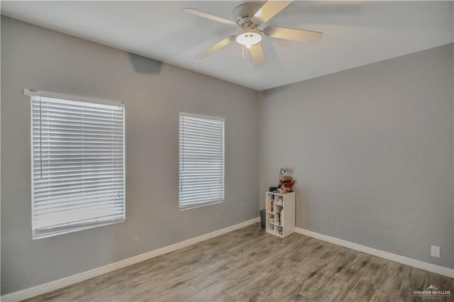 5302 Huisache Ave, Pharr, TX 78539 - spare room featuring wood finished floors, ceiling fan, and baseboards