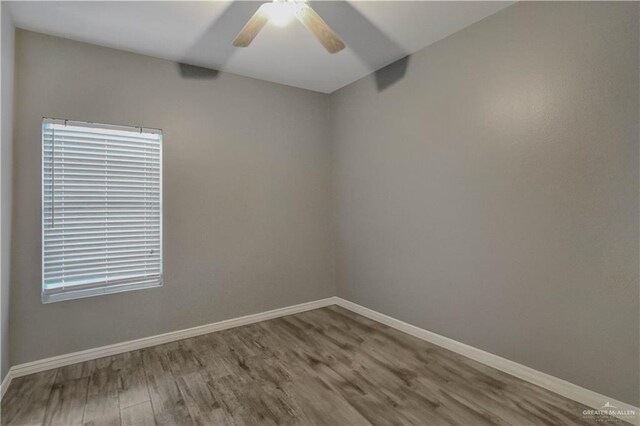 5302 Huisache Ave, Pharr, TX 78539 - empty room featuring wood finished floors, baseboards, and ceiling fan
