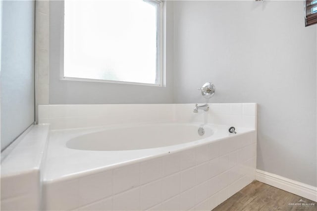 5302 Huisache Ave, Pharr, TX 78539 - bathroom with a bath and wood finished floors