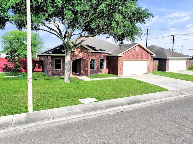 5302 Huisache Ave, Pharr, TX 78539 - single story home with brick siding, an attached garage, and driveway