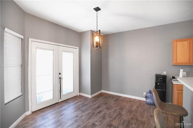 5302 Huisache Ave, Pharr, TX 78539 - dining space featuring french doors, dark wood-style floors, baseboards, and a chandelier