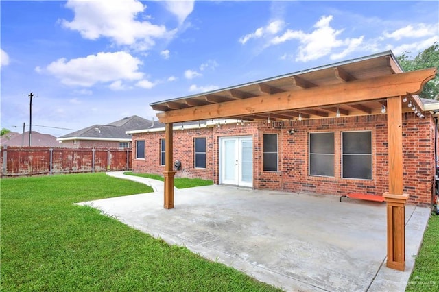 5302 Huisache Ave, Pharr, TX 78539 - back of property with brick siding and a patio area
