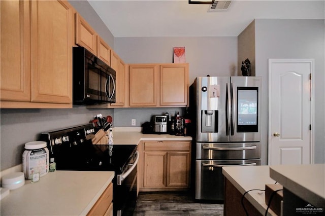 5302 Huisache Ave, Pharr, TX 78539 - kitchen with black microwave, stainless steel refrigerator with ice dispenser, range with electric stovetop, light brown cabinets, and light countertops