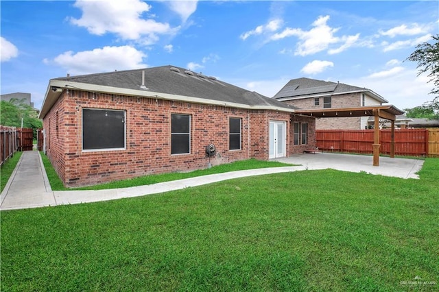 5302 Huisache Ave, Pharr, TX 78539 - back of house featuring brick siding and a patio