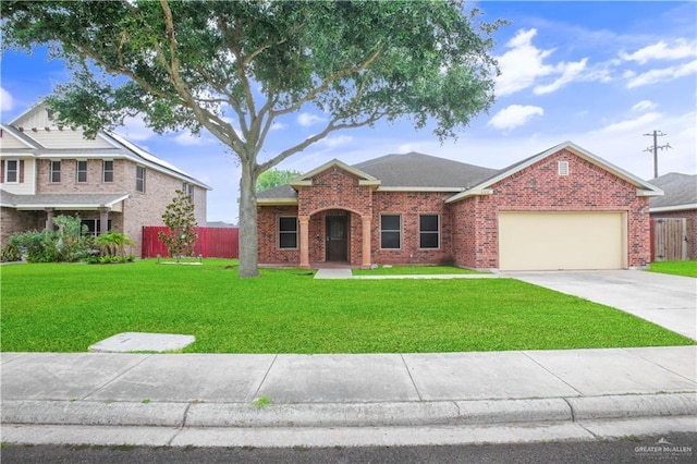 5302 Huisache Ave, Pharr, TX 78539 - traditional-style home featuring brick siding, a garage, and driveway