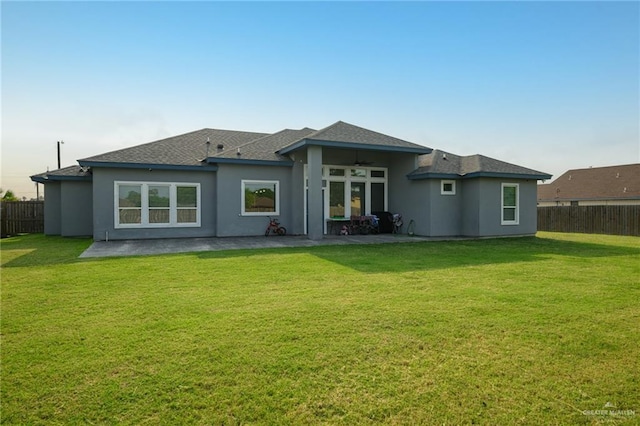 1102 Palm Blvd, Laguna Vista, TX 78578 - back of house featuring a patio area, a ceiling fan, stucco siding, and a shingled roof