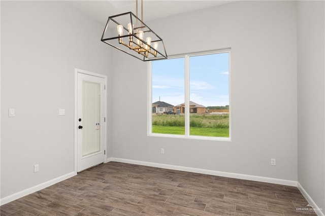 interior space featuring a chandelier and hardwood / wood-style floors