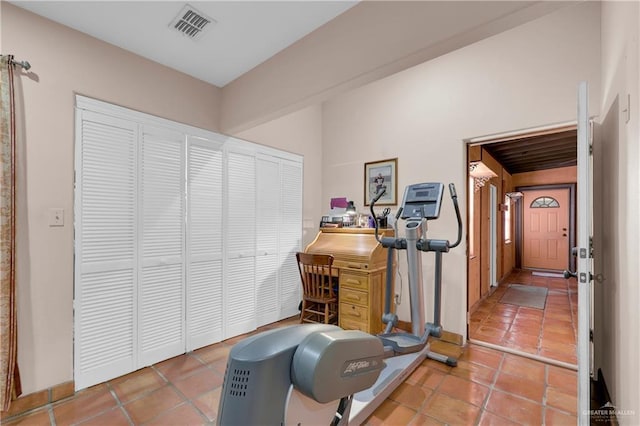 exercise area featuring tile patterned floors