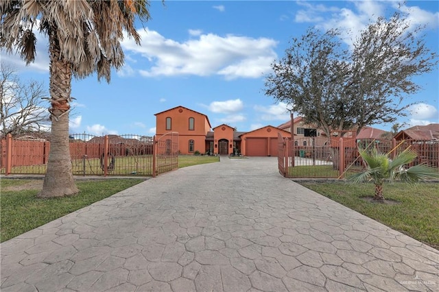 view of front of home with a garage and a front lawn