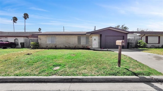 single story home featuring a garage and a front lawn