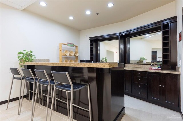 813 Travis St Unit 416, Mission, TX 78572 - bar featuring recessed lighting, baseboards, and light tile patterned floors