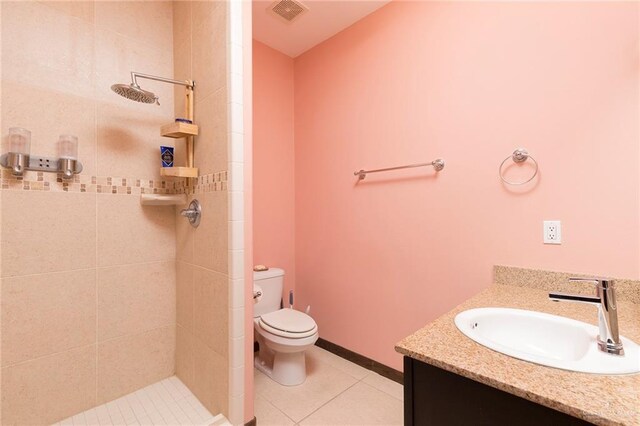 813 Travis St Unit 416, Mission, TX 78572 - bathroom with vanity, a tile shower, toilet, tile patterned flooring, and visible vents