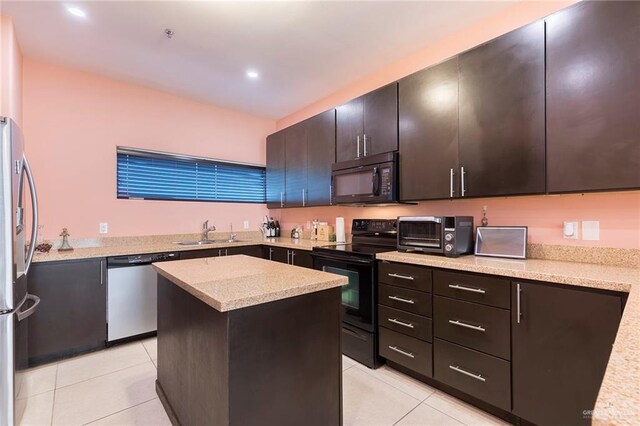 813 Travis St Unit 416, Mission, TX 78572 - kitchen featuring a sink, black appliances, light tile patterned flooring, a toaster, and a kitchen island