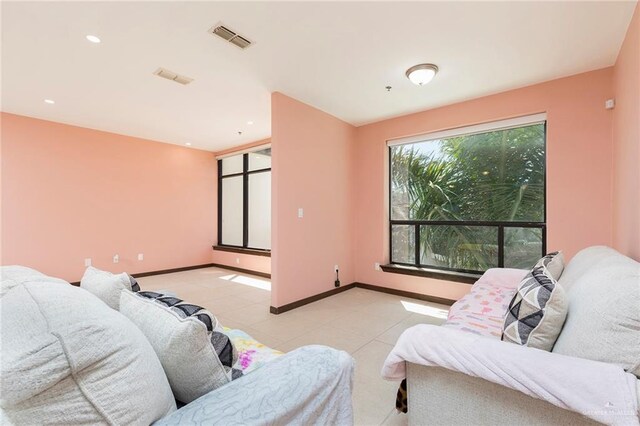 813 Travis St Unit 416, Mission, TX 78572 - living room featuring baseboards, visible vents, recessed lighting, and light tile patterned floors