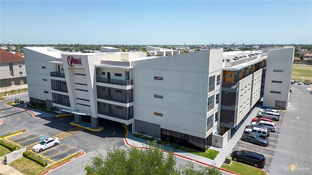 813 Travis St Unit 416, Mission, TX 78572 - view of building exterior with uncovered parking