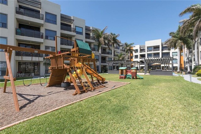 813 Travis St Unit 416, Mission, TX 78572 - community play area with a residential view and a lawn