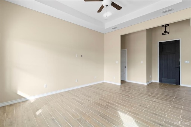 unfurnished room with ceiling fan and light hardwood / wood-style flooring